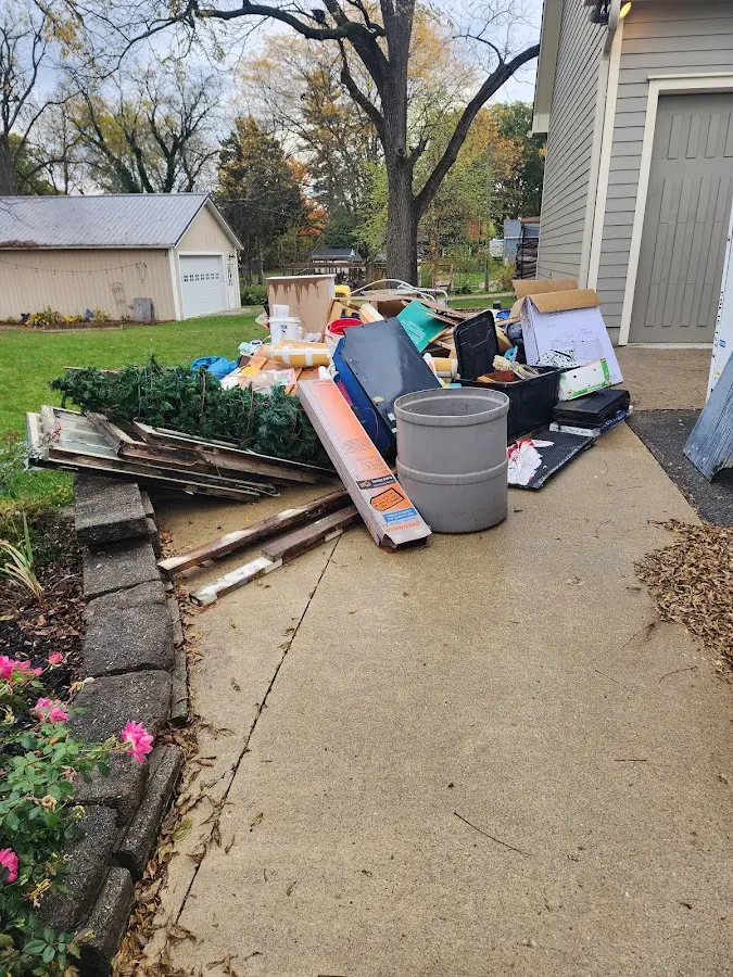 Dumpster being loaded with debris for Commercial Dumpster Rental in Meadville